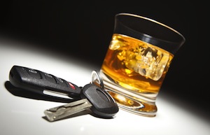 Alcoholic Drink and Car Keys Under Spot Light