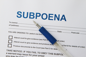Close up picture of Subpoena with pen